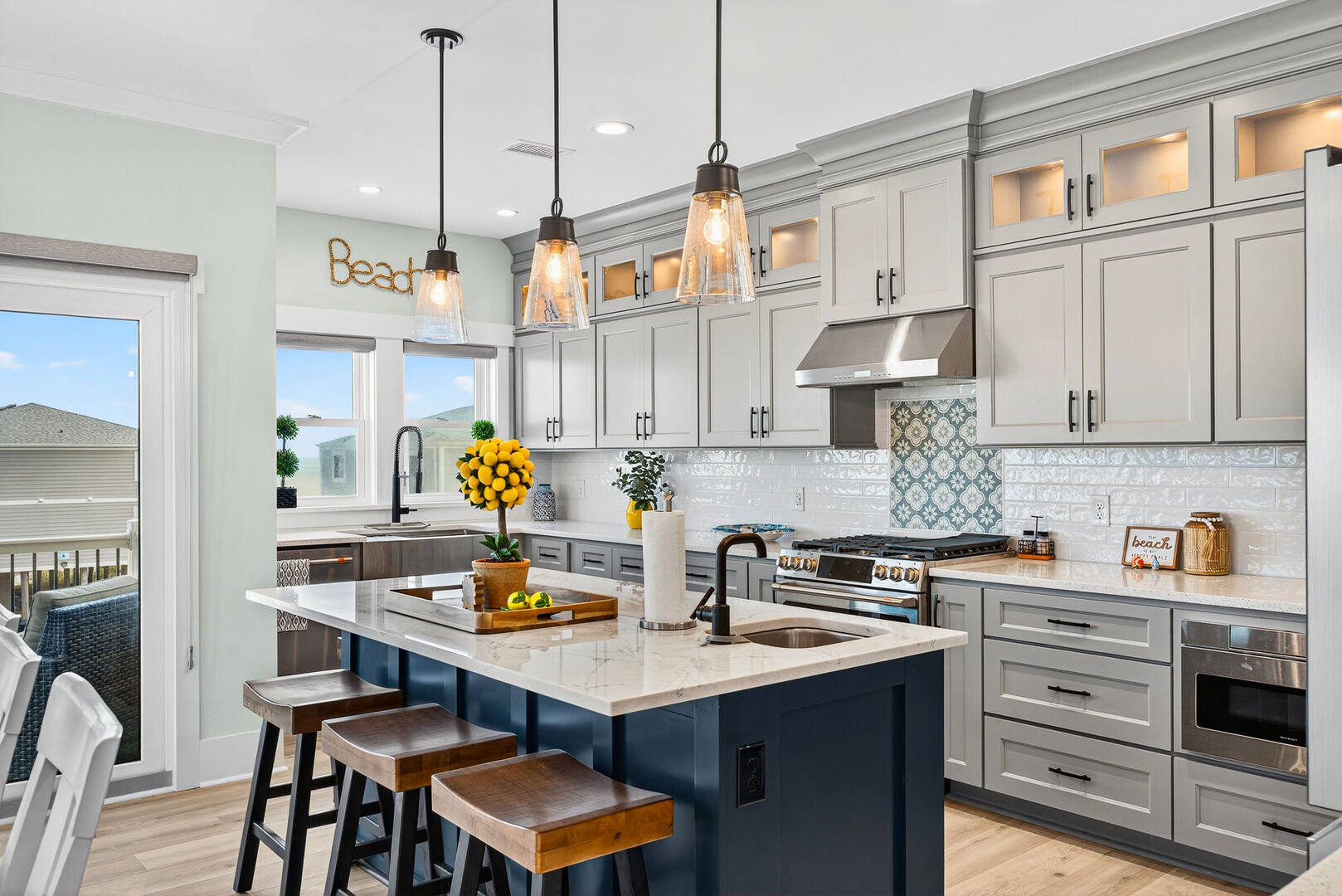 Gourmet kitchen with large island and premium appliances